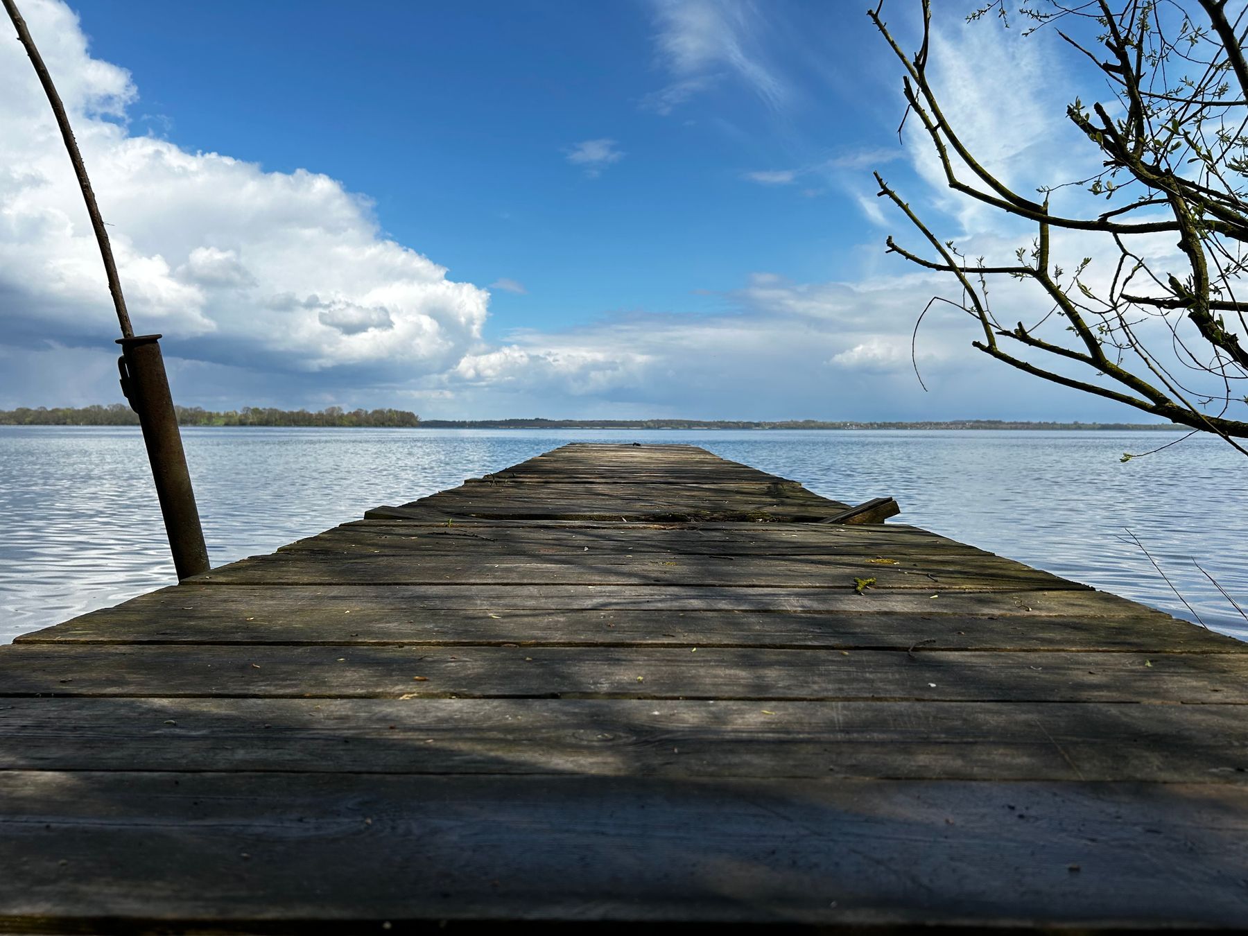 A deserted pier on a calm lake