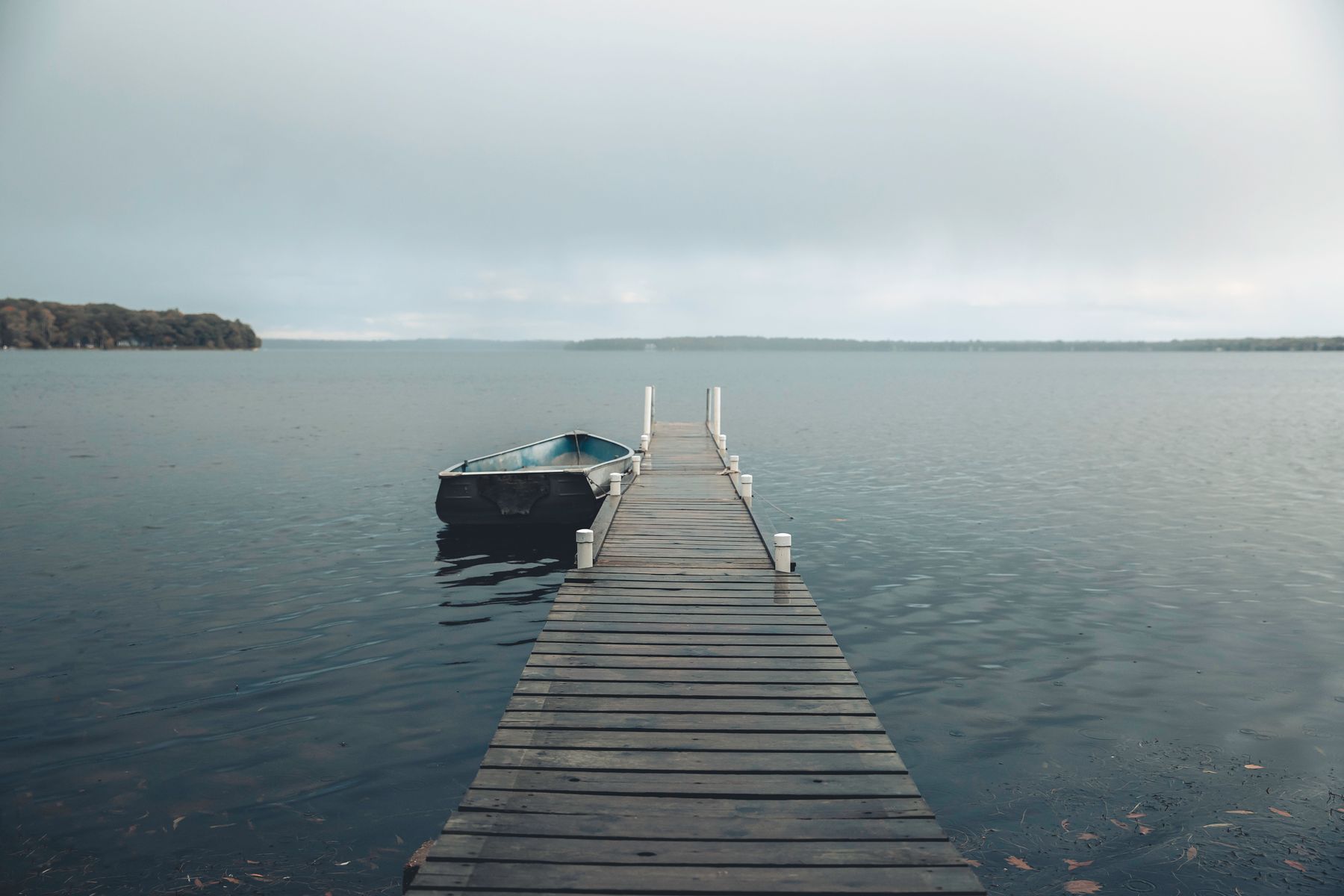 A wooden dock stretching into calm water